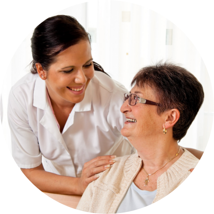 Caregiver and Elderly smiling each other